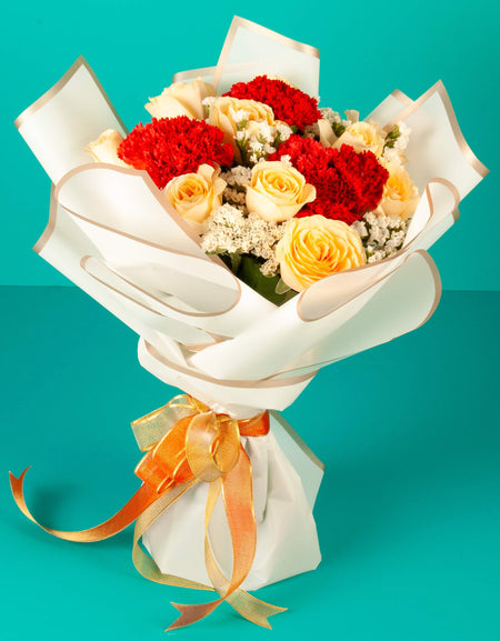 flower delivery to pune - yellow roses and red carnations hand tied bouquet
