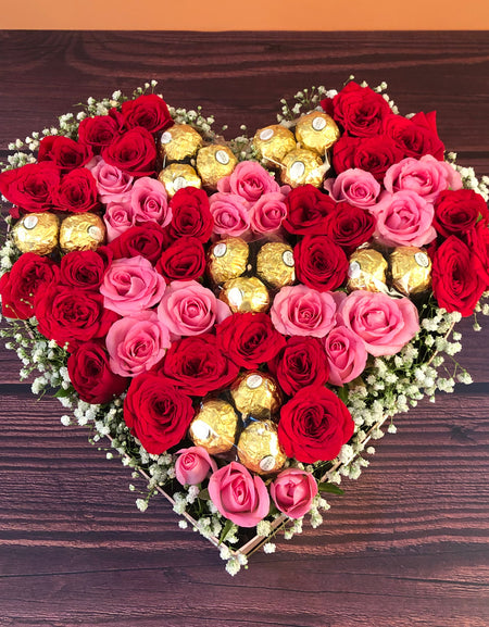 Roses and Chocolates in a Heart Shaped Box