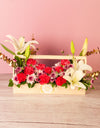 flower delivery pune - Chrysanthemums, carnations, and lilies arranged in a wooden basket