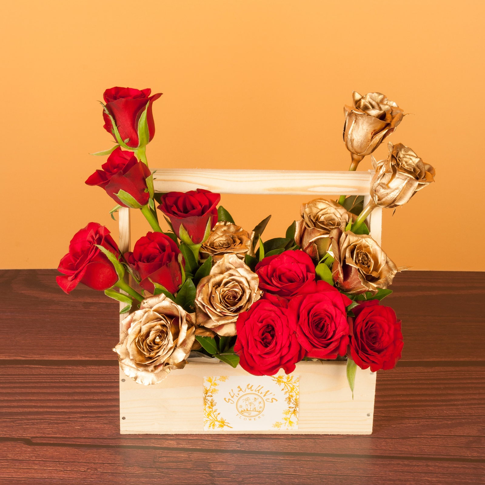 flower bouquet online - gold and red roses in a wooden basket