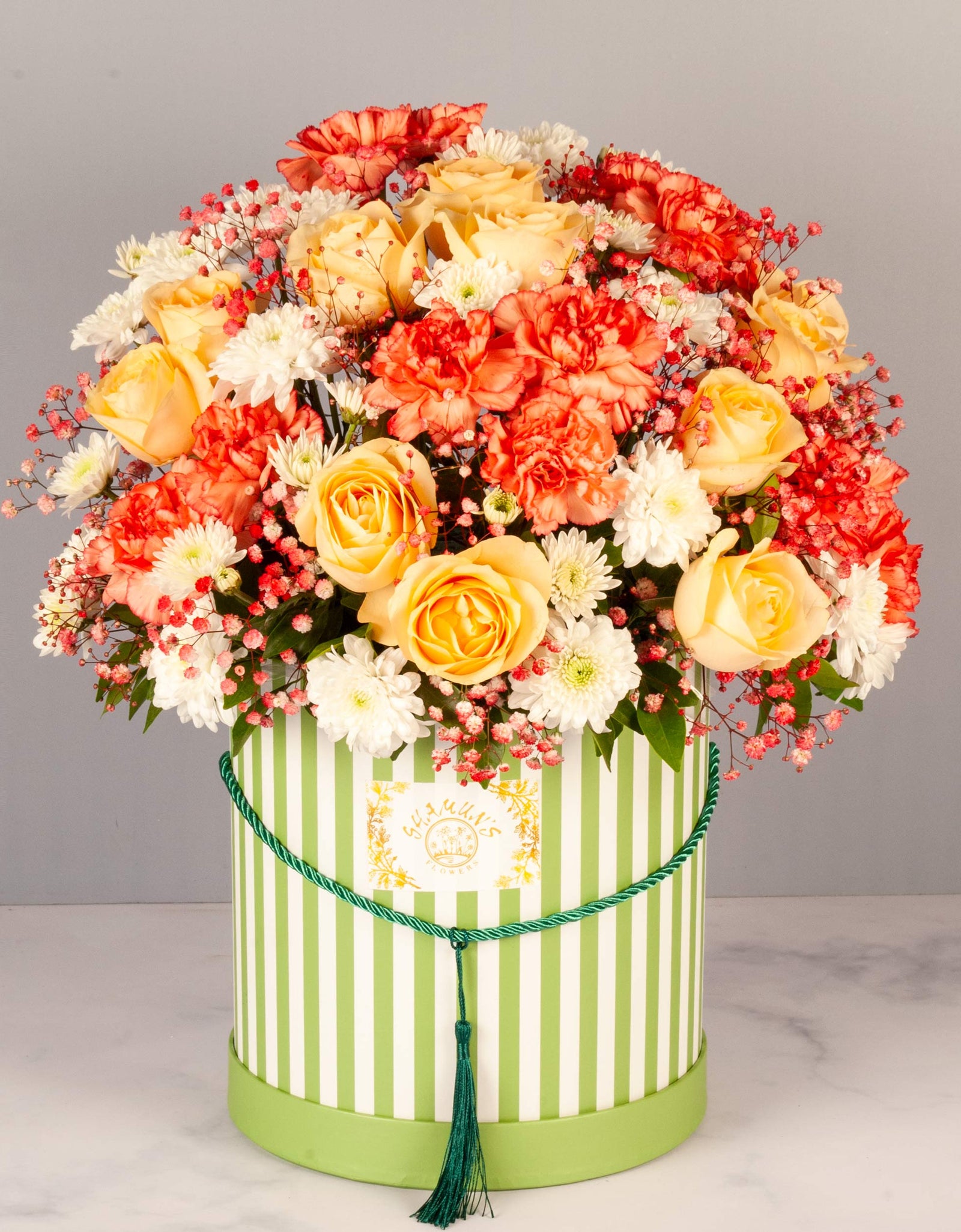flower delivery to pune - flowers of bright colors arranged in a striped box