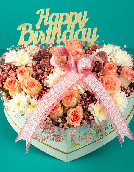 online flower delivery - flowers arranged in heart shaped box. bouquet for birthday