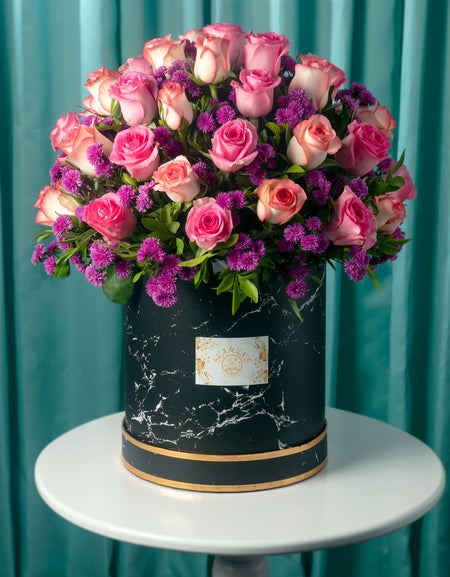 flower delivery pune - pink and peach roses, and purple fillers